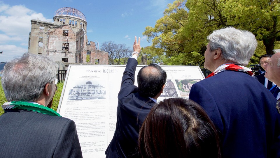 Hiroshima Mayor Kazumi Matsui shows U.S. Secretary of State John Kerry and others the Hiroshima Peace Memorial — the remains of the former Prefectural Industrial Promotion Hall in Hiroshima, Japan